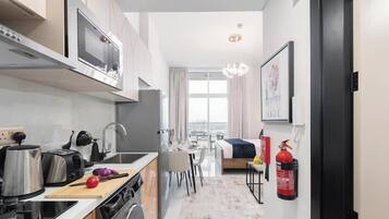 Luxury Studio, Balcony, City View | Private kitchen | Full-size fridge, microwave, oven, stovetop