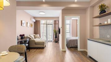 Apartment, City View | Desk, laptop workspace, blackout drapes, iron/ironing board