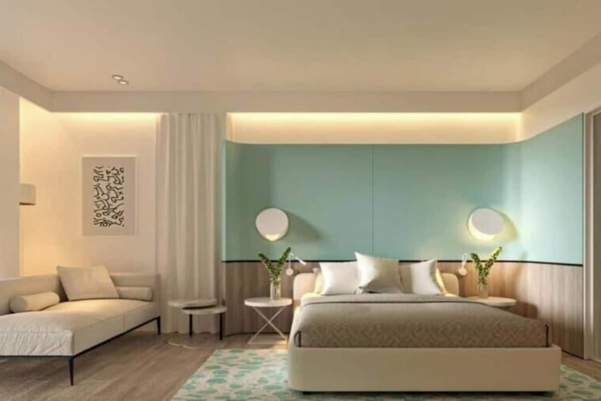Deluxe Triple Room, Sea View | Minibar, in-room safe, desk, laptop workspace