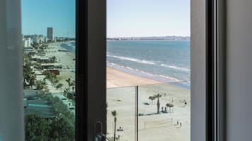 Superior Double Room, Partial Sea View | Minibar, in-room safe, desk, laptop workspace