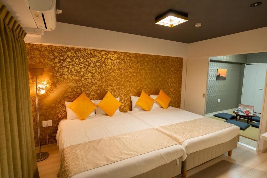 Apartament Deluxe, pati hawaià, vistes a la ciutat | Caixa forta a l'habitació i escriptori 