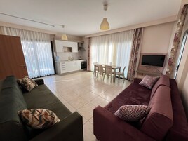 Family Apartment, Balcony, Sea View | Living area