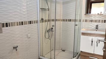 Family Apartment, Balcony, Sea View | Bathroom | Shower, free toiletries, hair dryer, slippers