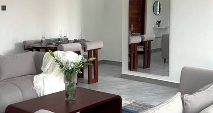 Canaan Residence near Mlimani City shopping mall. Cozy and Clean family home.