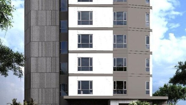 A multi-story building with a modern architectural design, featuring a prominent logo on the left facade. - The Citi Residenci Hotel Palasdiha (Durgapur)