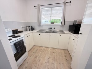 Microwave, oven, toaster, cookware/dishes/utensils - Three by the Sea-Stansbury- Close to the beach! Off Peak special available! (Stansbury)