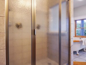Shower, hair dryer, towels, toilet paper