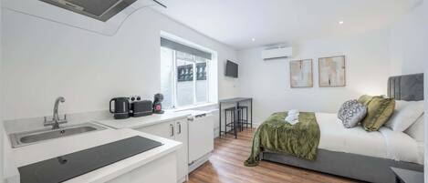 Fridge, microwave, stovetop, coffee/tea maker