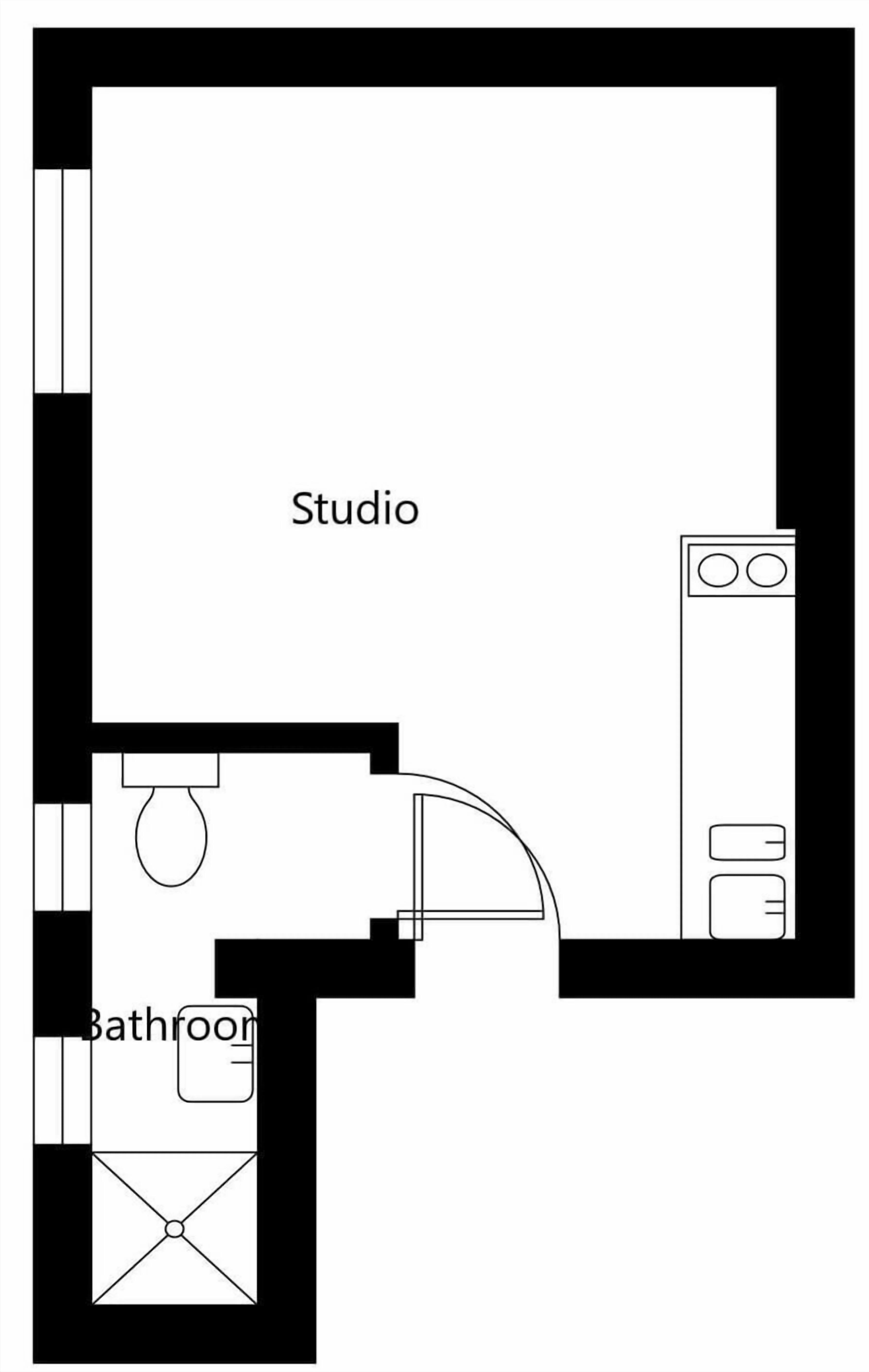 A studio with a bathroom, including a toilet, sink, and shower.