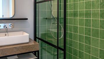 Shower, hair dryer, towels, toilet paper