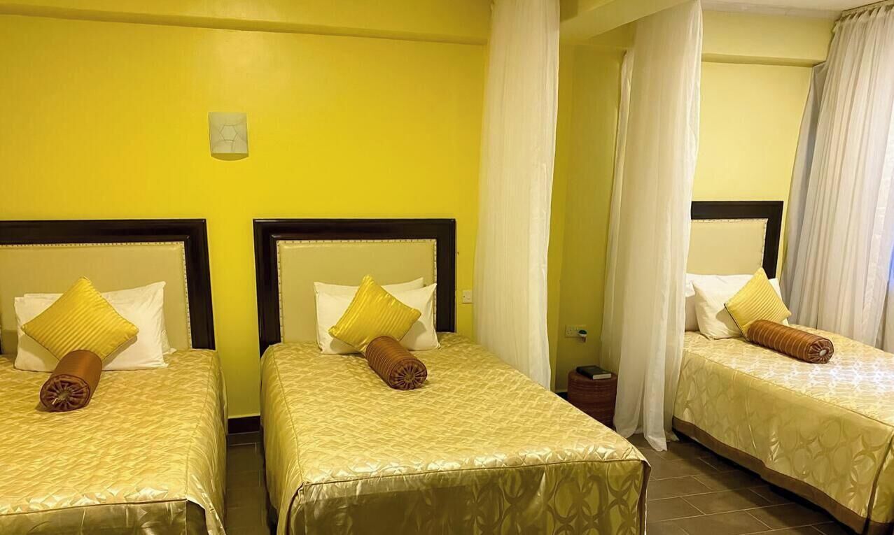 Standard Triple Room, Garden View | In-room safe, blackout curtains, soundproofing