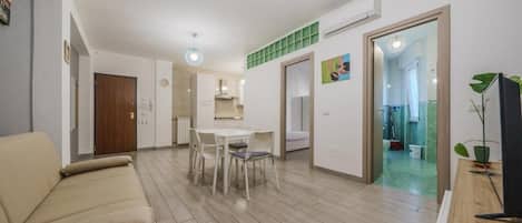 Superior Apartment | Living area | Flat-screen TV