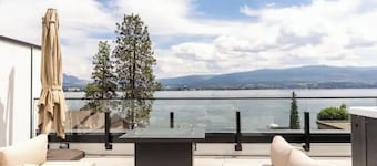 Luxury 4-bed, 3.5-bath home in Shelter Bay, West Kelowna. High-end finishings, rooftop deck with hot tub and full Okanagan Lake views, plus private beach access. Minutes to downtown, wineries, and outdoor adventures.