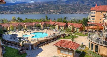 Newly renovated 2,000 sq ft penthouse loft at Discovery Bay. Sleeps 12 with 4 bedrooms, new kitchen, 3 full baths, custom stone media wall, and glass loft wall. Lake views, steps to beach, plus pools, gym, hot tub, games room & 2 secured parking stal