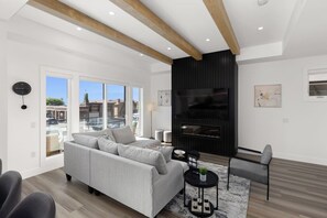 Living area - Luxury 4-bed, 3.5-bath home in Shelter Bay, West Kelowna. High-end finishings, rooftop deck with hot tub and full Okanagan Lake views, plus private beach access. Minutes to downtown, wineries, and outdoor adventures. (West Kelowna)
