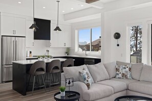 Living area - Luxury 4-bed, 3.5-bath home in Shelter Bay, West Kelowna. High-end finishings, rooftop deck with hot tub and full Okanagan Lake views, plus private beach access. Minutes to downtown, wineries, and outdoor adventures. (West Kelowna)