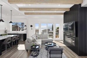 Living area - Luxury 4-bed, 3.5-bath home in Shelter Bay, West Kelowna. High-end finishings, rooftop deck with hot tub and full Okanagan Lake views, plus private beach access. Minutes to downtown, wineries, and outdoor adventures. (West Kelowna)