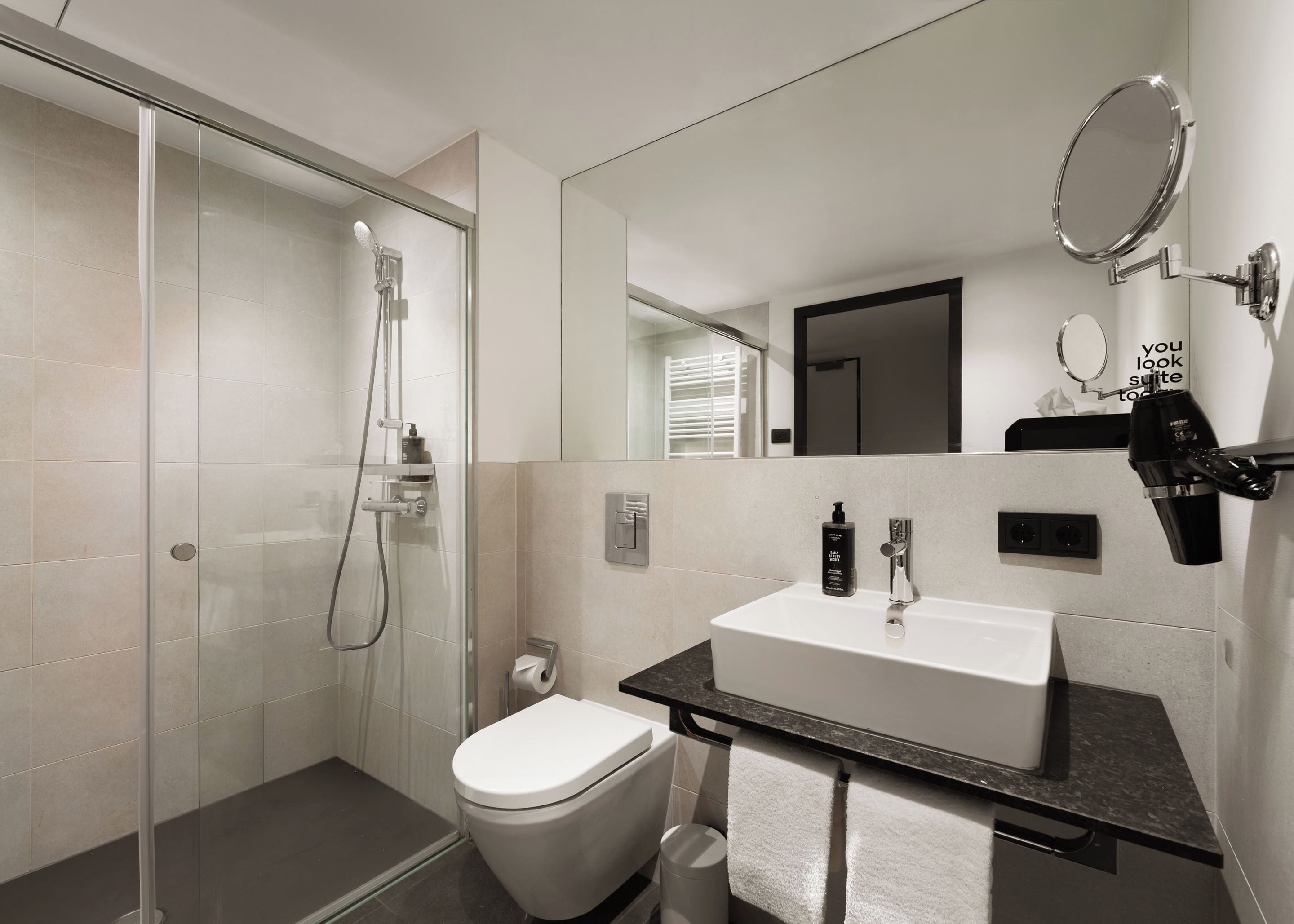 Shower, eco-friendly toiletries, hair dryer, towels