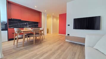 Deluxe Apartment, 2 Bedrooms | Living area | 42-cm flat-screen TV with satellite channels