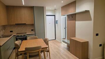 Deluxe Apartment, 2 Bedrooms | Living area | 42-cm flat-screen TV with satellite channels