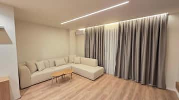 Deluxe Apartment, 2 Bedrooms | Living area | 42-cm flat-screen TV with satellite channels