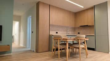 Deluxe Apartment, 2 Bedrooms | Living area | 42-cm flat-screen TV with satellite channels