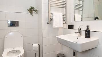 Shower, rainfall showerhead, hair dryer, towels
