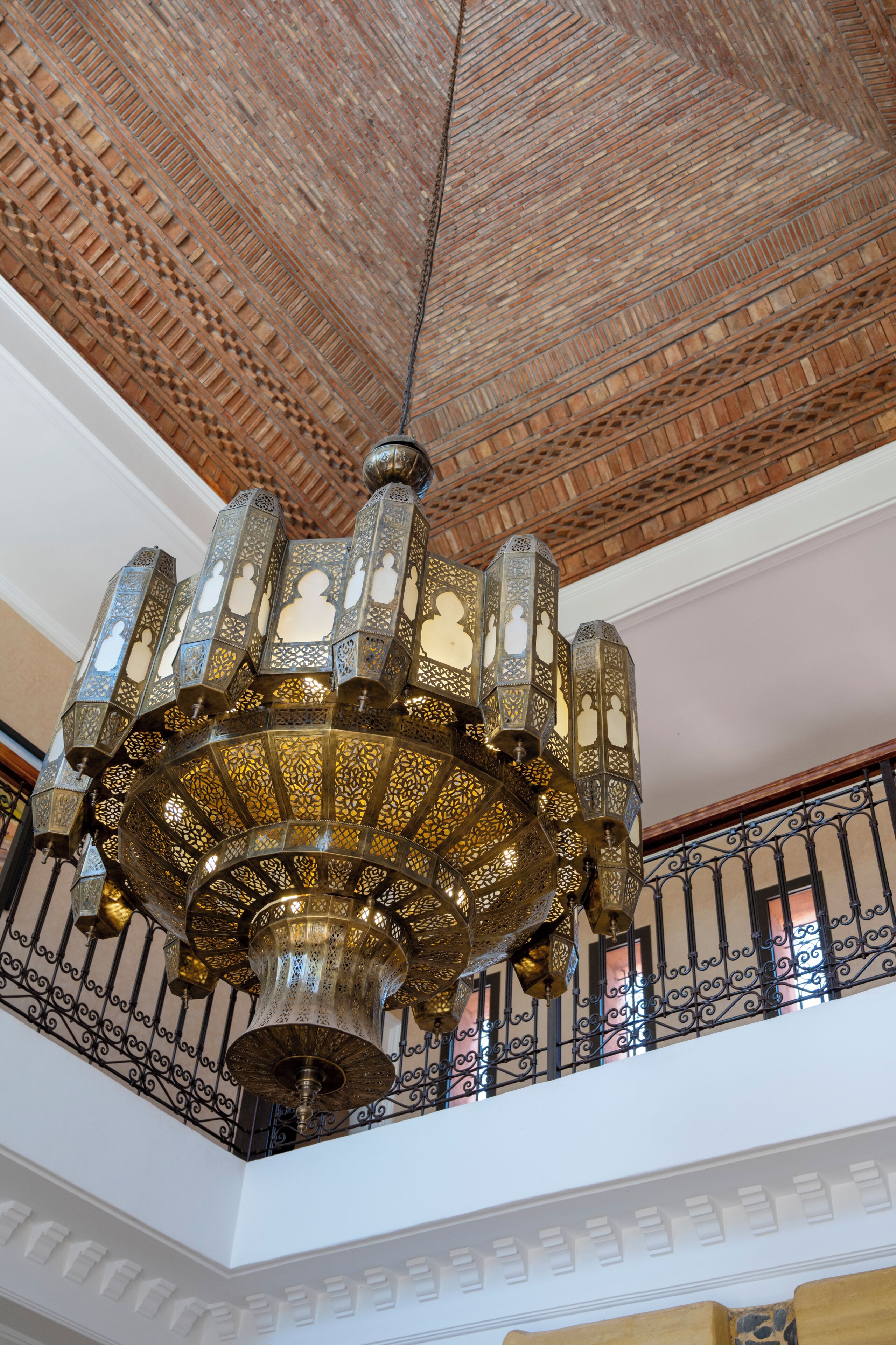 A chandelier with intricate metalwork and multiple light sources.