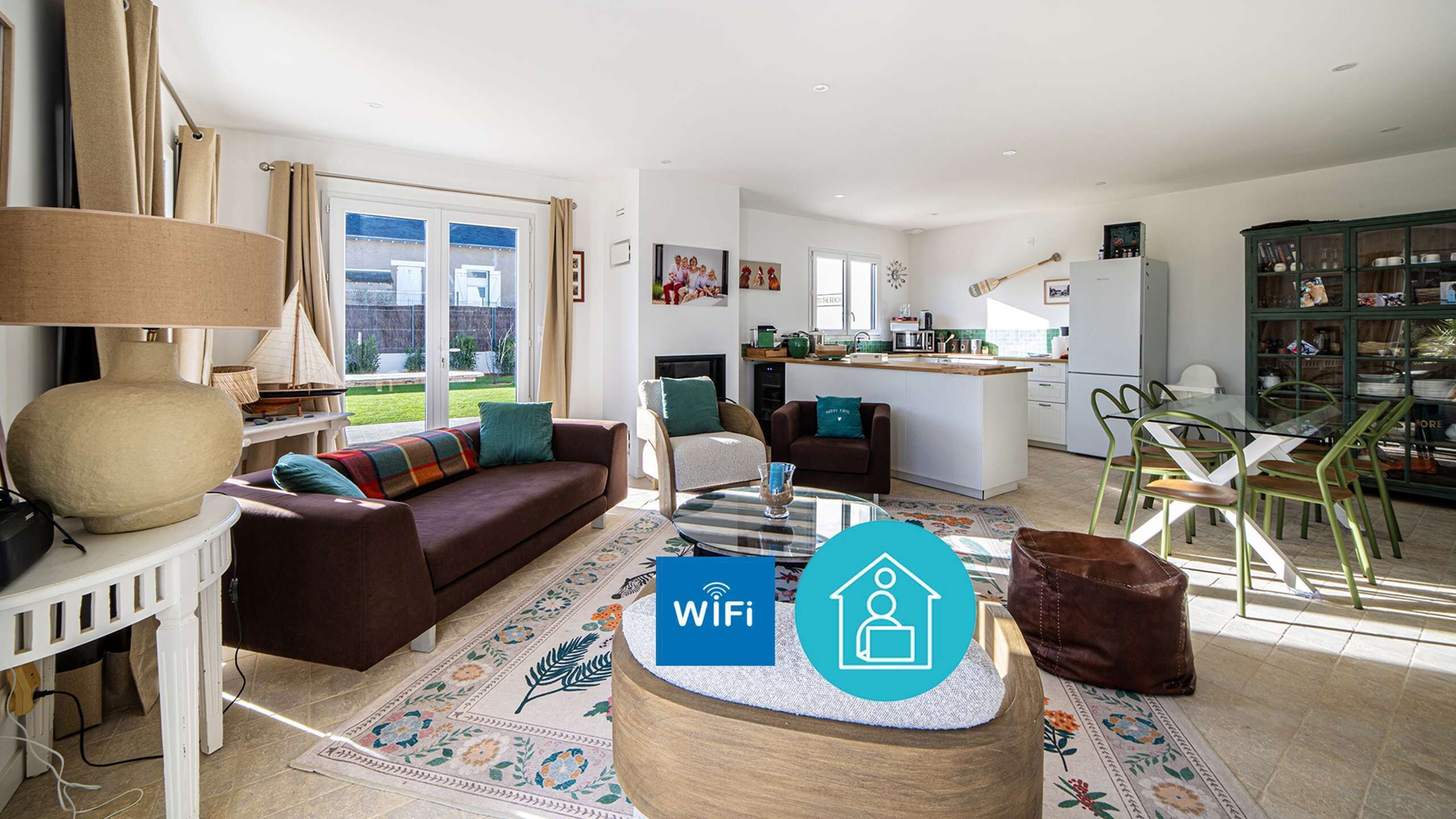 A modern living room with a sofa, coffee table, and a dining area with chairs.