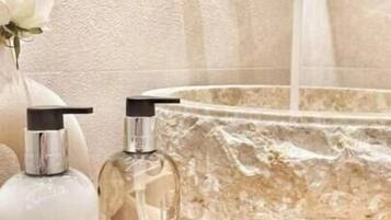 Shower, free toiletries, slippers, towels