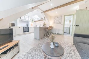 A modern loft-style apartment with an open-plan kitchen, dining area, and living space. - Otterbield, Apartment 4, ,Derwent House (Portinscale)