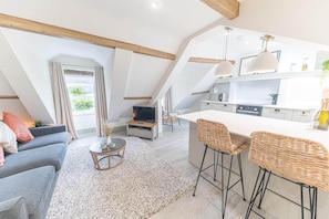 A modern loft with a kitchen, dining area, and living room. - Otterbield, Apartment 4, ,Derwent House (Portinscale)