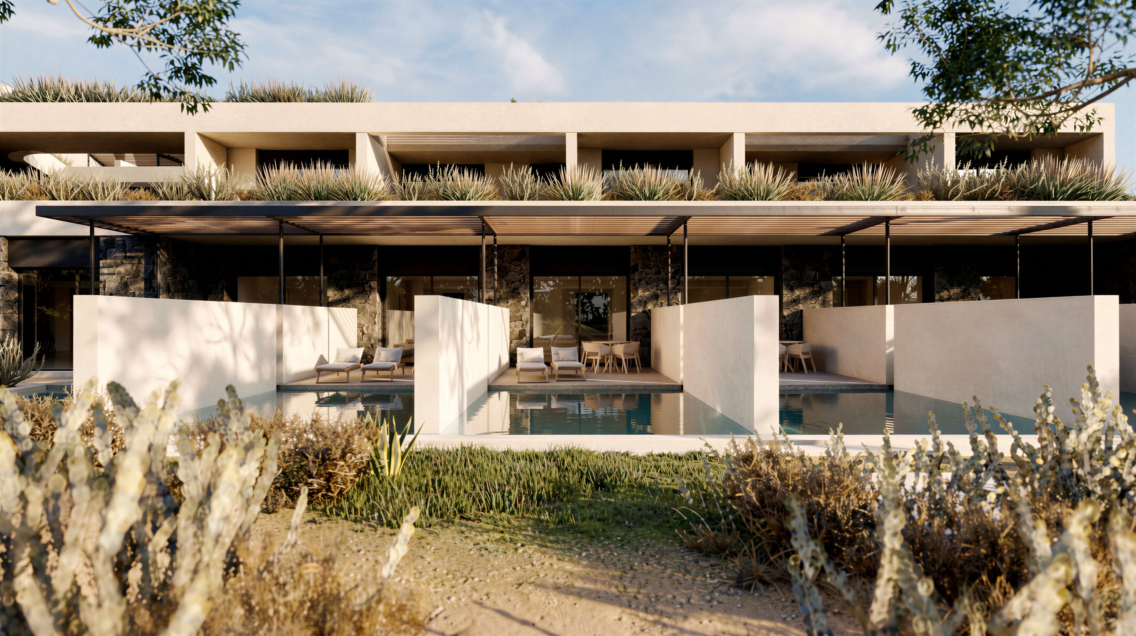 Un edificio moderno con piscina, zona de estar exterior y fachada de piedra.