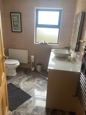Shower, hair dryer, towels, soap