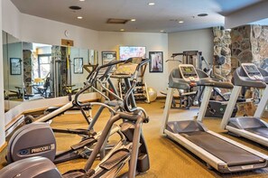 Indoor gym featuring cardio equipment, strength machines, and free weights. - Big Sky Mountain Retreat | Ski-In/Ski-Out (Big Sky)