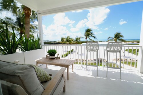 Serene 1-bedroom apartment offering stunning beachfront views.