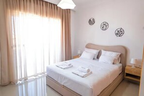 1 bedroom, desk, iron/ironing board, travel crib