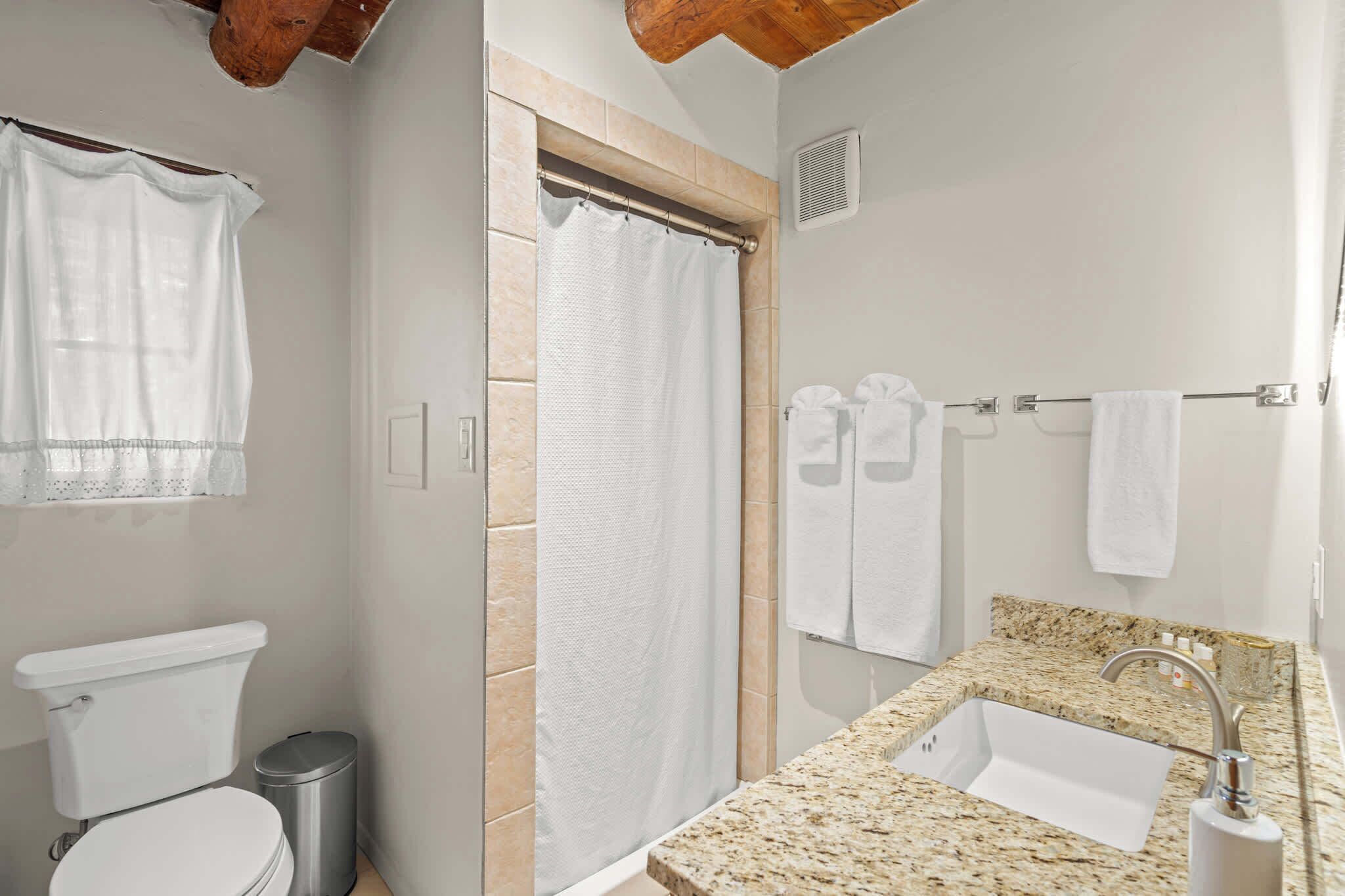 Shower, hair dryer, towels, shampoo