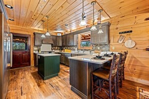 Unclassified image, 4 of 58, button - Cabin w/ 2 Hot Tubs · Theater · Game Room (Sevierville)