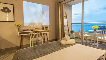 Apartment, Balcony, Beach View | Desk, laptop workspace, blackout drapes, iron/ironing board