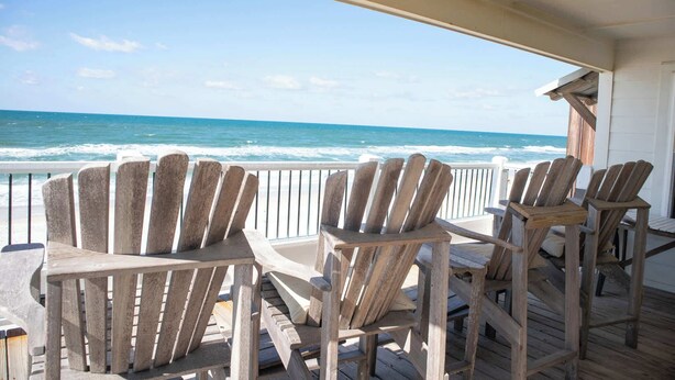 A wooden deck with Adirondack chairs overlooking the ocean. - Rehab- Beach front, Sleeps 9 (Port St. Joe)