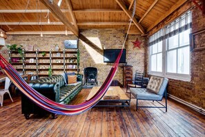 TV, fireplace, offices - East London loft penthouse with epic roof terrace and loads of space (London)