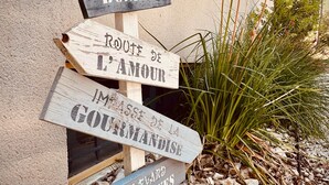 A wooden signpost with multiple directional signs.