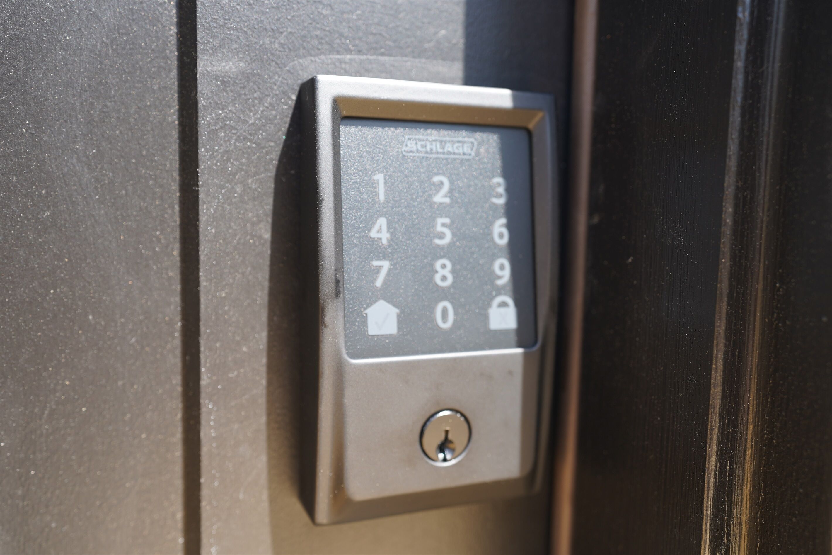 A keypad lock on a door, likely for a hotel room.