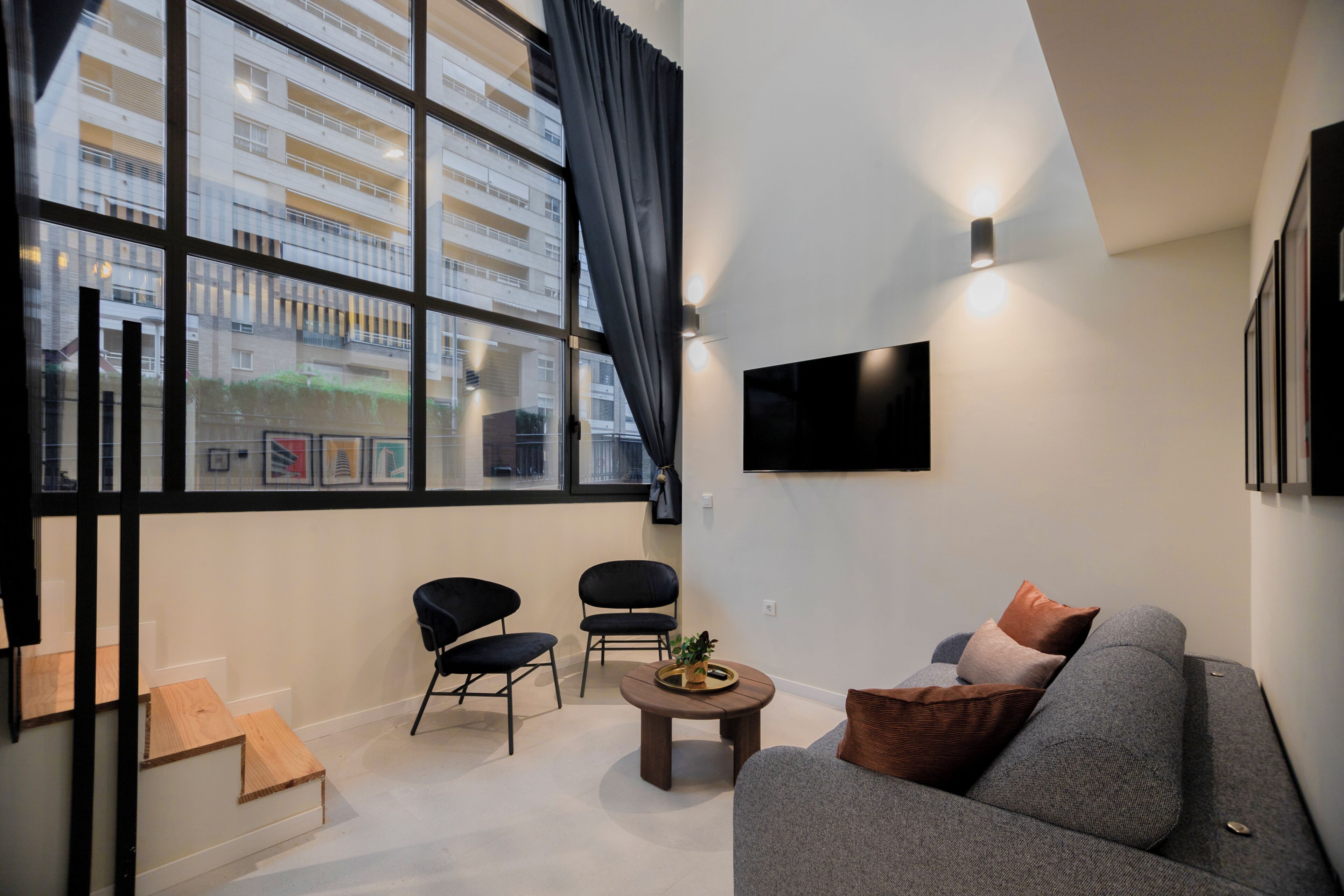 Dúplex Deluxe | Zona de estar | Una televisión