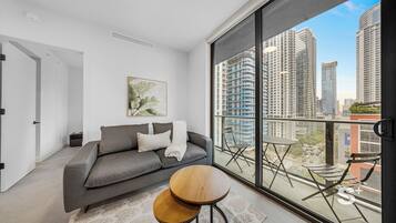 Condo, Balcony, City View | Living area | 36-inch Smart TV with cable channels
