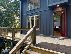 A modern building with a wooden deck and a red door. - Ski-In ⛷ & Golf with Million-Dollar Mountain Views, Quick Drive to Asheville (Mars Hill)