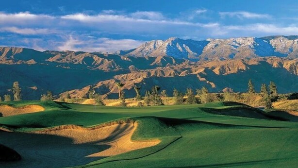 A golf course with rolling green hills, sand bunkers, and a backdrop of mountains. - April 12-16th - FLASH SALE - Marriott Shadow Ridge - Full Access Resort (Palm Desert)