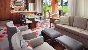 A modern kitchen with a microwave, a dining table with chairs, a sofa, and a patterned rug. - April 12-16th - FLASH SALE - Marriott Shadow Ridge - Full Access Resort (Palm Desert)