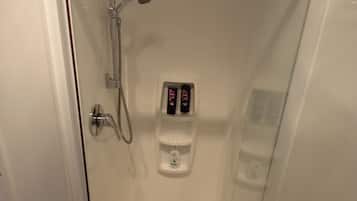 Shower, hair dryer, towels, shampoo